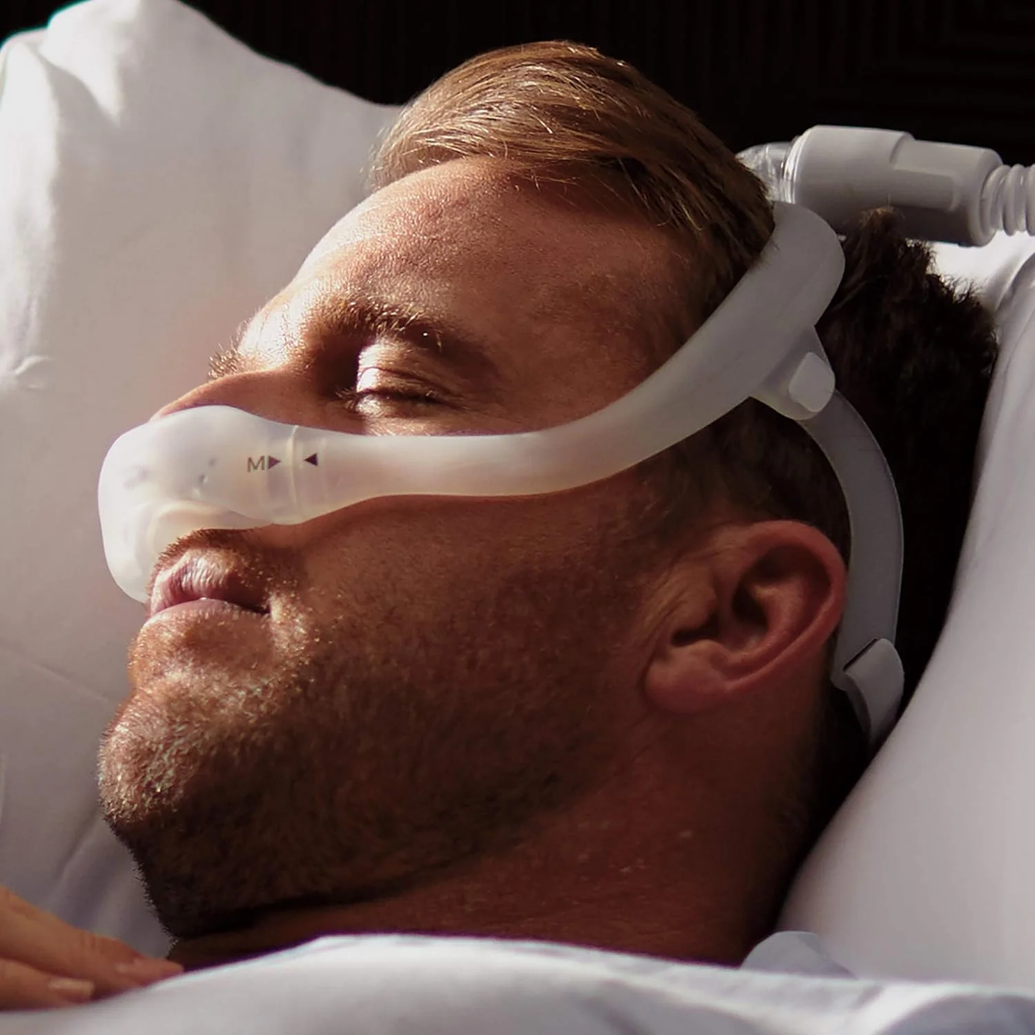 Philips DreamWear nasal CPAP mask with top-of-head hose and open field of view